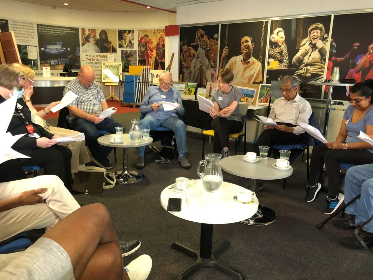 Attendees of the Carers Café are sat in a circle.